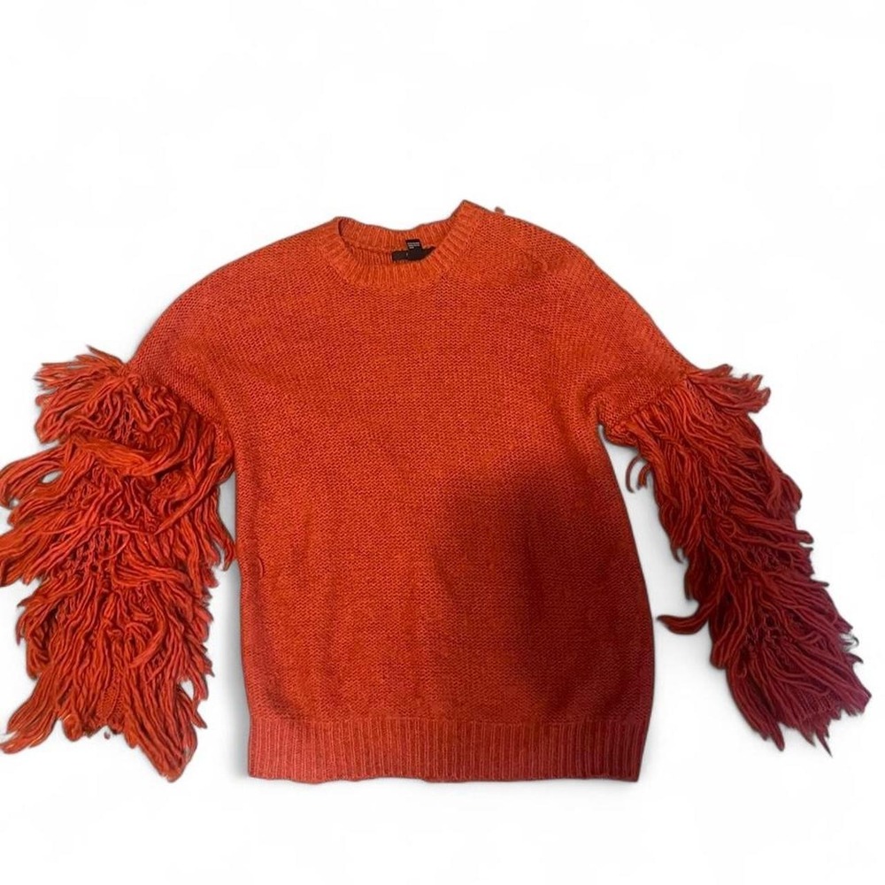 'Forever 21 orange sweater with fringe sleeves in a